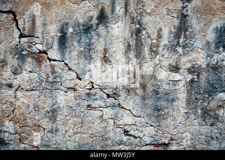 Vintage toned picture of an old grunge cracked wall, background or texture. Stock Photo