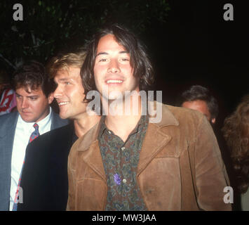 WESTWOOD, CA - JULY 10: (L-R) Actors Patrick Swayze and Keanu Reeves attend the premiere of 'Point Break' on July 10, 1991 at Avco Center Theater in Westwood, California. Photo by Barry King/Alamy Stock Photo Stock Photo