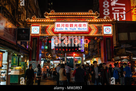 Taipei Taiwan, 14 february 2018 : street view of Raohe Street food Night Market full of people and entrance gate in Taipei Taiwan Stock Photo