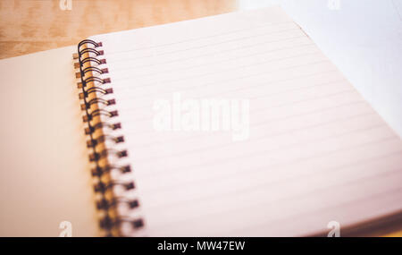 notebook on wooden table Stock Photo