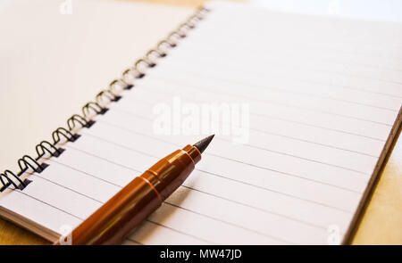 notebook on wooden table Stock Photo