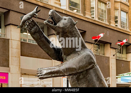 Bear catching salmon sculpture on Sparks street in Ottawa, Ontario, Canada. Stock Photo