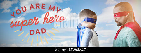 Composite image of father and son pretending to be superhero Stock Photo