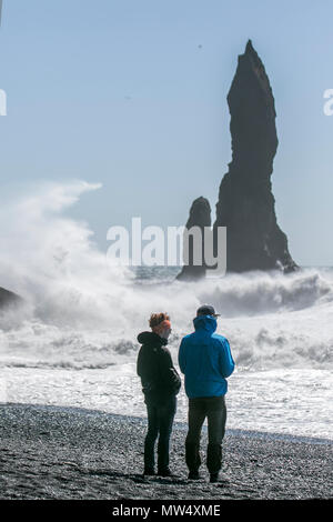 Storm force waves and raging seas on the coastline at Vik, Reynisfjara and Kirkjufjara, basalt rock formation & dangerous black sand beaches in Iceland. Stock Photo