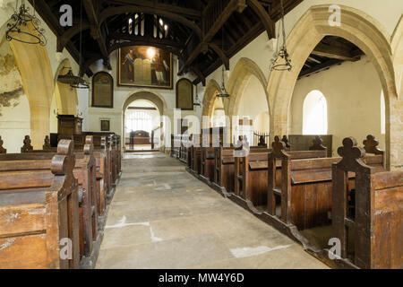 Interior of historic quaint St Martin's Church with wooden pews, aisle & hammerbeam roof in nave -  Allerton Mauleverer, North Yorkshire, England, UK. Stock Photo