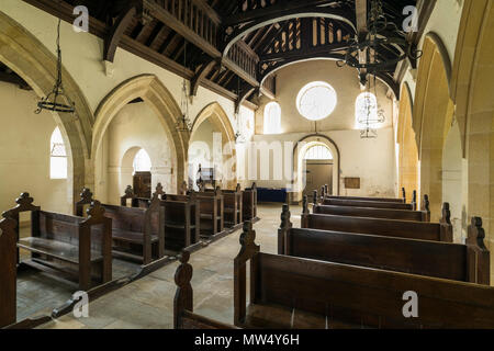 Interior of historic quaint St Martin's Church with wooden pews, aisle & hammerbeam roof in nave -  Allerton Mauleverer, North Yorkshire, England, UK. Stock Photo