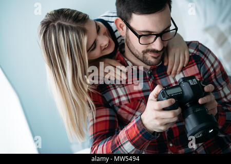 Young attractive designers working on project together Stock Photo