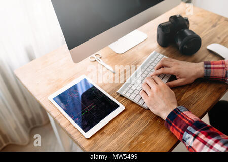 Close-up picture of man working on computer Stock Photo