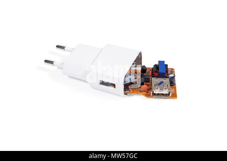 Broken charger in white color. Close-up. Isolated on white background. Stock Photo