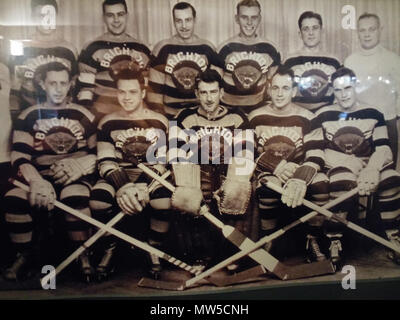 . English: A shot of the Brighton Tigers Ice Hockey Team taken in the late 1930's. Author unknown. Found hanging on the wall of The Basketmakers Arms pub in Brighton on 06/02/2015. Any more information is welcome. 6 February 2016, 19:02:47. Unknown author 98 Brighton Tigers Ice Hockey Team Stock Photo