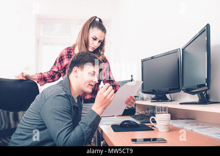 Team job succes. Photo young business managers working with new startup project in office. Analyze document, plans.Paperwork on wooden table, papers,  Stock Photo