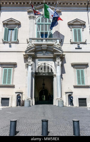 Quirinal Palace facade (main entrance), official residence of the President of the Italian Republic. Presidential,Italian, European Flags. Rome, Italy Stock Photo