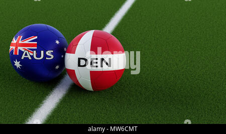 Denmark vs. Australia Soccer Match - Soccer balls in Australia and Denmarks national colors on a soccer field. Copy space on the right side - 3D R Stock Photo