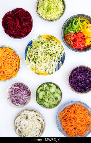 Spiralized Vegetables in bowls on a white background. Pattern Stock Photo