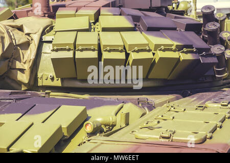 Battle tank layered with reactive armour bricks, that reacts in some way to the impact of a weapon to reduce the damage done to the vehicle being prot Stock Photo