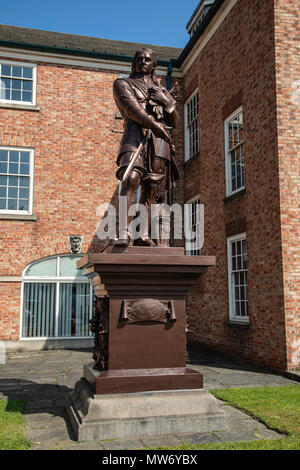 A Grade II listed statue of Oliver Cromwell  on a plinth in the grounds of the Warrington Academy Building Warrington Cheshire May 2018 Stock Photo