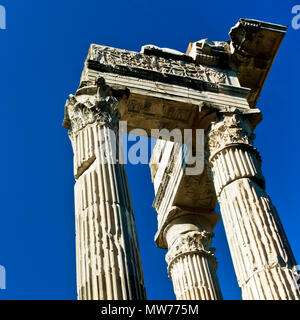 Low angle view of three columns from Apollo Sosiano's Temple, Sunny, blue sky. Rome, Italy, Europe. Classical corinthian style.Copy space, close up. Stock Photo