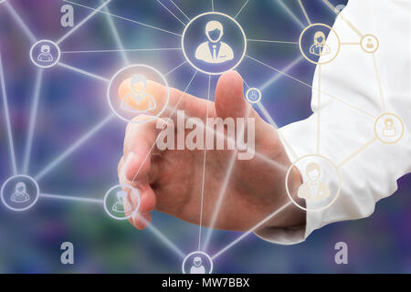 hand of a a businessman touching technology interface with contact icon Stock Photo
