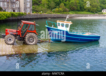 fishing boat liberty belle being launched on castletownshend slipway after a winter haul out for repainting. Ireland. Stock Photo