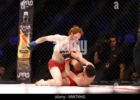 Mixed Martial Artist Connor Hignett (left) lands punches on Aaron Aby during a catchweight contest at ACB 54 in Manchester, UK. Aby won after three rounds by split decision. Absolute Championship Berkut, Mixed Martial Arts, MMA. Stock Photo