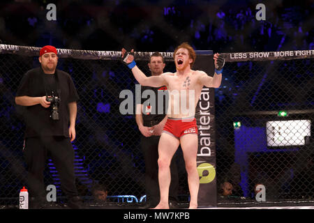 Mixed Martial Artist Connor Hignett gestures for the win at the conclusion of his catchweight contest against Aaron Aby at ACB 54 in Manchester, UK. Aby won by split decision. Absolute Championship Berkut, Mixed Martial Arts, MMA. Stock Photo