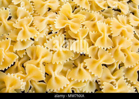 Italian Pasta Farfalle as a Background. Stock Photo