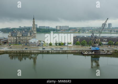 Pilotage building and crane as seen from the MAS museum on a rainy day, Antwerp, Belgium Stock Photo