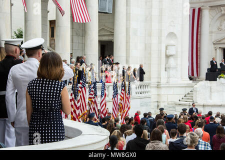 Guests attend the 2018 Memorial Day Wreath Laying Ceremony at the Tomb of the Unknown Soldier, Arlington National Cemetery, Arlington, Va., May 28, 2018. Each year a ceremonial wreath is placed at the tomb, honoring the sacrifice made by service members who lost their lives in service to the United States of America. (U.S. Marine Corps photo by Cpl. Hailey D. Clay) Stock Photo