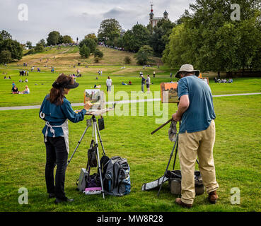 Pair of artisits painting the Greenwich Observatory in Greenwich, London, UK taken on 28 September 2014 Stock Photo