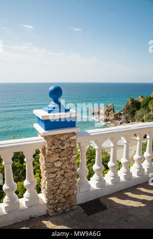 Nerja beach promenade with white balustrades against the blue background of the Mediterranean Stock Photo