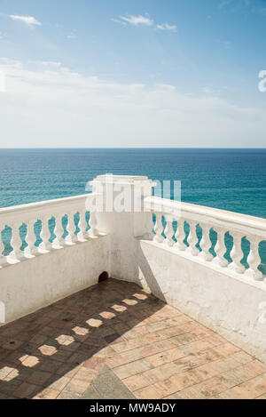 Nerja beach promenade with white balustrades against the blue background of the Mediterranean Stock Photo