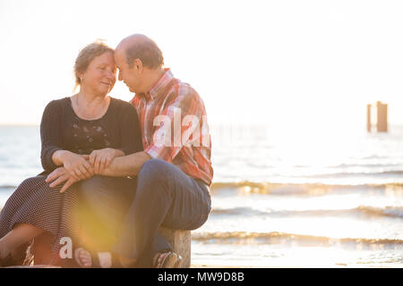 Close-up of old couple embracing outdoors. Stock Photo