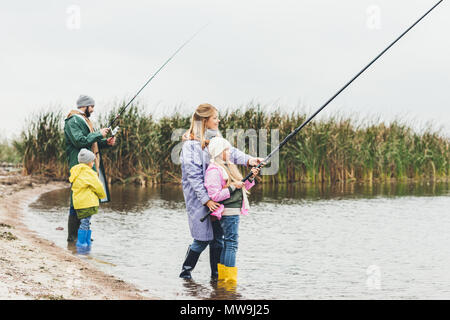 Happy brother and sister fishing at sea during summer vacation Stock Photo  - Alamy