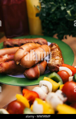 Close-up view of meat sausages grilled for outdoors barbecue Stock Photo