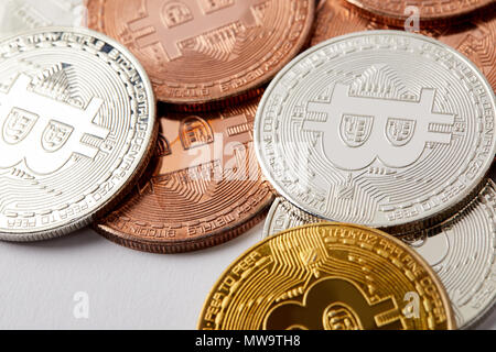 full frame shot of different bitcoins on white surface Stock Photo