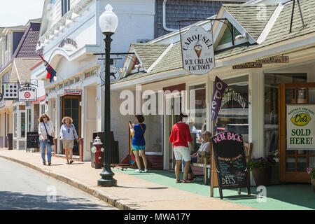 Shops and restaurants line Circuit Avenue, the main shopping district in downtown Oak Bluffs, Massachusetts on Martha's Vineyard. Stock Photo