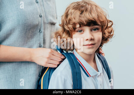 loving mother and adorable little son with backpack Stock Photo
