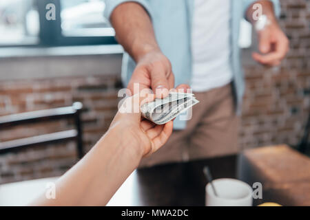 cropped shot of dad giving pocket money to daughter Stock Photo