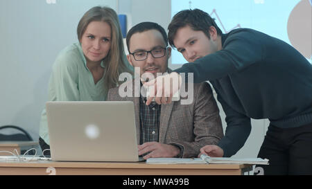 Students taking a selfie with their teacher in classroom during a break Stock Photo