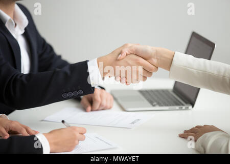 Hr handshaking successful candidate getting hired at new job, cl Stock Photo