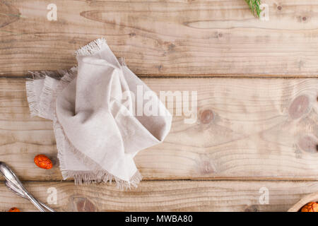 Gray textile napkin on a wooden table. place for text. Copy space. Flat lay Stock Photo