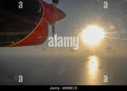 View of Maldives seaplaned of the Maldivian Air Taxi airline from Male, Aerial airborne view of islands and atolls within the Maldives, Indian Ocean.  Stock Photo