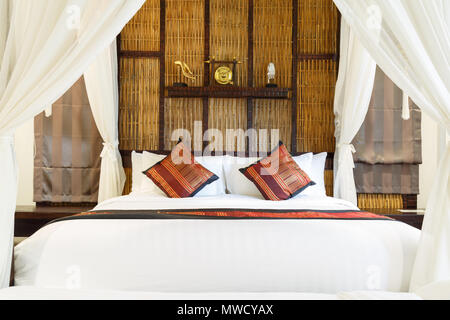 Luxury bedroom vintage or retro design and pillow in hotel. Stock Photo