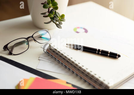 Office scene: financial graphs and charts. Financial data concept Stock Photo