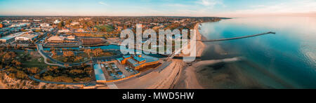 Aerial panorama of Frankston suburb yacht club, footbridge, and pier at sunset. Melbourne, Australia Stock Photo