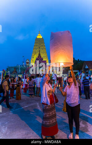 Kanchanaburi, Thailand - September 16, 2016: Buddhist Mon people celebrate the month of merit festival at Pagoda of Bodhgaya in Sangkhlabri, Kanchanab Stock Photo