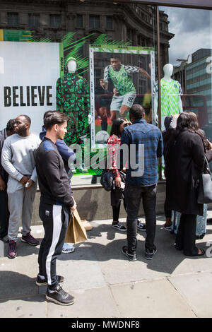 London, UK. 1st June, 2018. Fans of the Super Eagles, the Nigerian national football team, queue outside Nike's flagship store in Oxford Street to buy football kits for the forthcoming FIFA 2018 World Cup. The Nigerian Football Federation revealed that over three million pre-orders had been received for the kit and kits are understood to have sold out online. Credit: Mark Kerrison/Alamy Live News Stock Photo