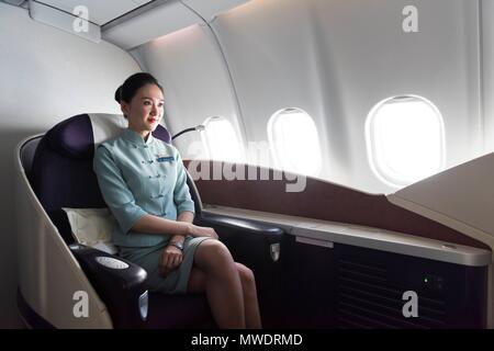 Cabin crew at the New China Southern Airlines flight from London to Wuhan that took off from Heathrow Airport on 30 May at 22:10pm and arrived to Wuhan Airport on 31 May at 15:35pm. Wuhan, China. 31/05/2018 | usage worldwide Stock Photo