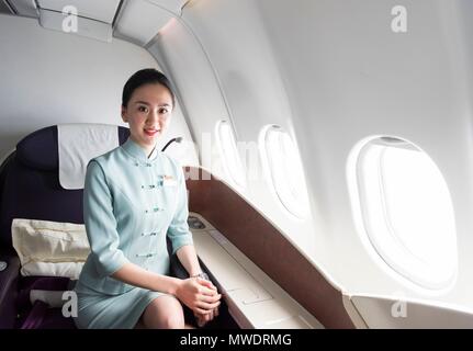 Cabin crew at the New China Southern Airlines flight from London to Wuhan that took off from Heathrow Airport on 30 May at 22:10pm and arrived to Wuhan Airport on 31 May at 15:35pm. Wuhan, China. 31/05/2018 | usage worldwide Stock Photo