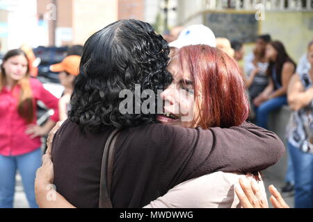 People celebrate and cries after seeing their relatives in buses outside Helicoide Jail in Caracas. The Government of Venezuela grants precautionary measures to political prisoners who were detained at the headquarters of the Bolivarian Intelligence Service (SEBIN). 39 political prisoners were released with precautionary measures by the government of Nicolas Maduro. Still more than 150 people continue behind bars for having participated in protests against the government. Among those released is the former Mayor of San Cristobal, state tachira, Daniel Ceballos; Retired General Angel Vivas and  Stock Photo